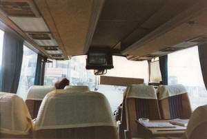 Fun photo showing Art's characteristic hair mop rising above the seats at the front of tour bus